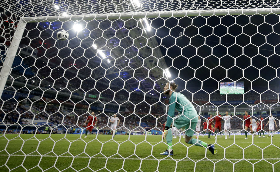 David De Gea helplessly watches the ball sail into the net, well beyond his reach, as Portugal score their third goal. AP David De Gea helplessly watches the ball sail into the net, well beyond his reach, as Portugal score their third goal. AP