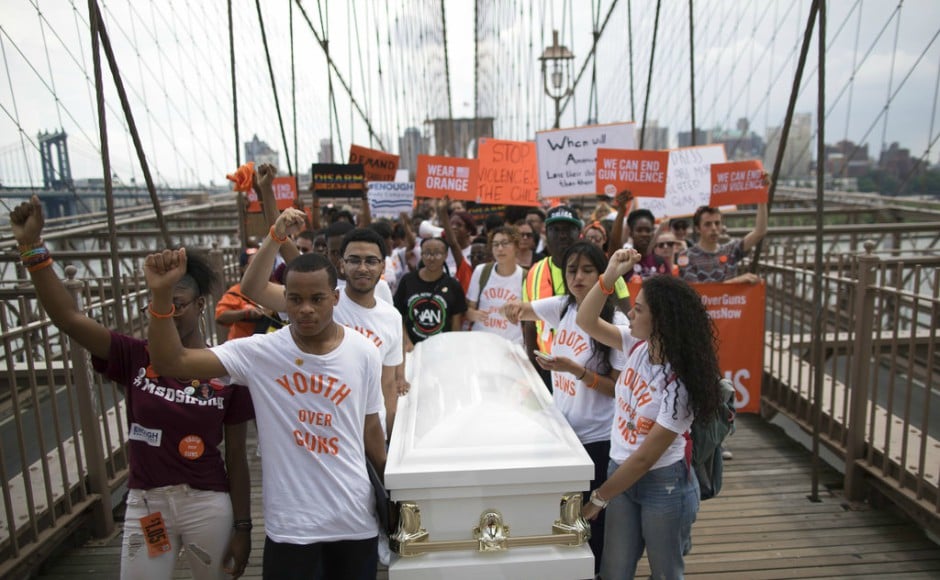 Demonstrators carry a coffin over the Brooklyn bridge during a march and rally against gun violence. About 40 percent of Americans say they own a gun or live in a household with one, according to a 2017 survey, and the rate of murder or manslaughter by firearm is the highest in the developed world. AP Demonstrators carry a coffin over the Brooklyn bridge during a march and rally against gun violence. About 40 percent of Americans say they own a gun or live in a household with one, according to a 2017 survey, and the rate of murder or manslaughter by firearm is the highest in the developed world. AP