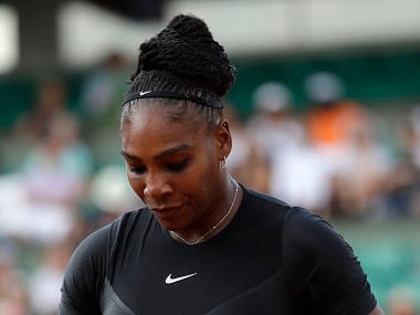 Serena Williams of the U.S. takes a tennis ball as she plays Australia's Ashleigh Barty during their second round match of the French Open tennis tournament at the Roland Garros stadium, Thursday, May 31, 2018 in Paris. (AP Photo/Alessandra Tarantino)