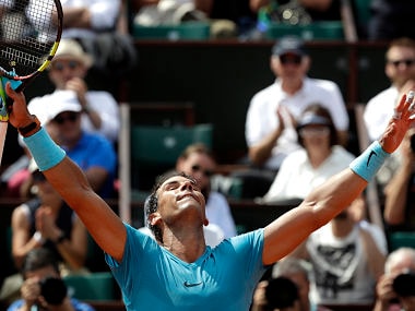 Spain's Rafael Nadal raises in arms in victory as after defeating Germany's Maximilian Marterer during their fourth match of the French Open tennis tournament at the Roland Garros stadium, Monday, June 4, 2018 in Paris. (AP Photo/Alessandra Tarantino)