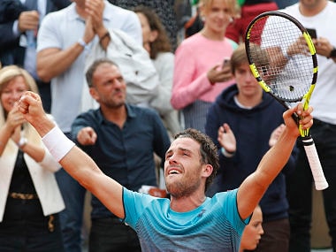 Italy's Marco Cecchinato celebrates winning his quarterfinal match of the French Open tennis tournament against Serbia's Novak Djokovic in four sets 6-3, 7-6 (7-4), 1-6, 7-6 (13-11) at the Roland Garros stadium in Paris, France, Tuesday, June 5, 2018. (AP Photo/Christophe Ena )
