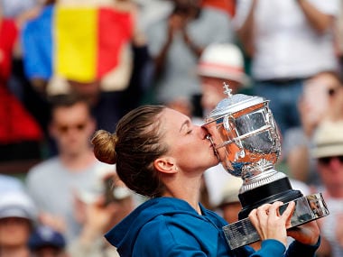 Romania's Simona Halep kisses the cup after defeating Sloane Stephens of the U.S. during their final match of the French Open tennis tournament at the Roland Garros stadium, Saturday, June 9, 2018 in Paris. Halep won 3-6, 6-4, 6-1. (AP Photo/Christophe Ena)