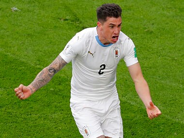Uruguay's Jose Gimenez scores the opening goal during the group A match between Egypt and Uruguay at the 2018 soccer World Cup in the Yekaterinburg Arena in Yekaterinburg, Russia, Friday, June 15, 2018. (AP Photo/Vadim Ghirda)