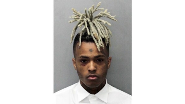 XXXTentacion fans grieve at murder site where American rapper was shot dead in attempted robbery