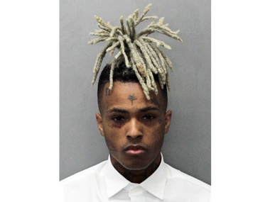 XXXTentacion fans grieve at murder site where American rapper was shot dead in attempted robbery XXXTentacion fans grieve at murder site where American rapper was shot dead in attempted robbery