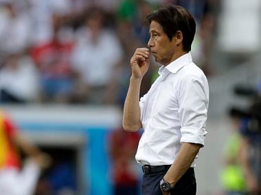 Japan's head coach Akira Nishino watches his players during the group H match against Poland. AP