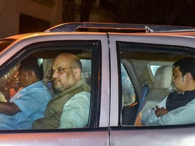 National BJP President Amit Shah and Maharashtra Chief Minister Devendra Fadnavis arrive at Shiv Sena chief Uddhav Thackerays residence. PTI