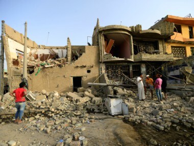 People gather at the site of an explosion in Baghdad's Sadr City district, Iraq June 7, 2018. REUTERS.
