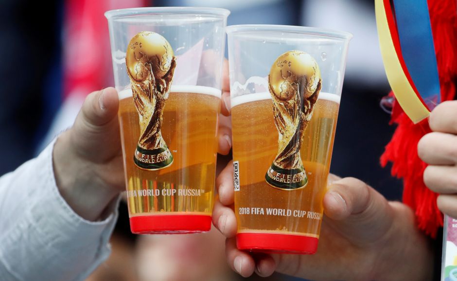 Fans holding their drinks before the match. Reuters Fans holding their drinks before the match. Reuters