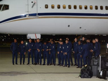 Brazil's players pose near a plane upon the arrival. Reuters