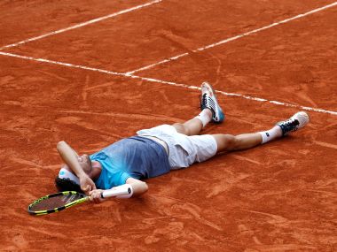 Marco Cecchinato celebrates winning his quarter-final match against Novak Djokovic. AFP