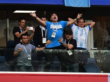 Former Argentina footballer Diego Maradona (centre) celebrates their opening goal against Nigeria. AFP