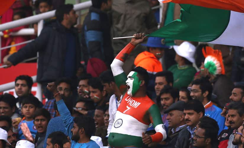 A fan of the Indian cricket team holds a national flag during the first One Day International ( ODI ) between India and Sri Lanka held at the Himachal Pradesh Cricket Association Stadium, Dharamsala on the 10th December 2017 Photo by Deepak Malik / BCCI / Sportzpics