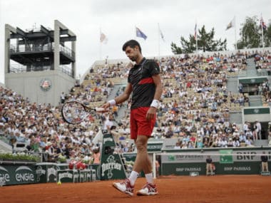 Serbia's Novak Djokovic gestures after missing a shot against Spain's Roberto Bautista Agut. AP