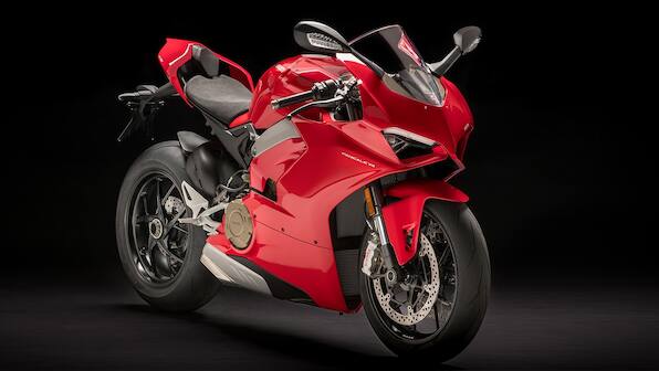 Four-cylinder Ducati Panigale V4 spotted in carbon fibre trim at UK dealership