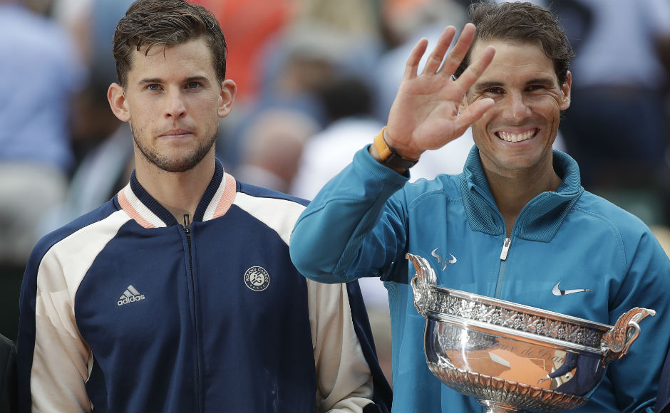 Eleven-times French Open winner Spain's Rafael Nadal, right, and runner-up Austria's Dominic Thiem hold the trophies after the men's final. AP Eleven-times French Open winner Spain's Rafael Nadal, right, and runner-up Austria's Dominic Thiem hold the trophies after the men's final. AP