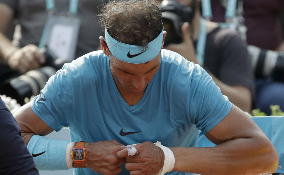 Spain's Rafael Nadal removes a bandage on his wrist in the men's final match of the French Open tennis tournament against Austria's Dominic Thiem. AP Spain's Rafael Nadal removes a bandage on his wrist in the men's final match of the French Open tennis tournament against Austria's Dominic Thiem. AP