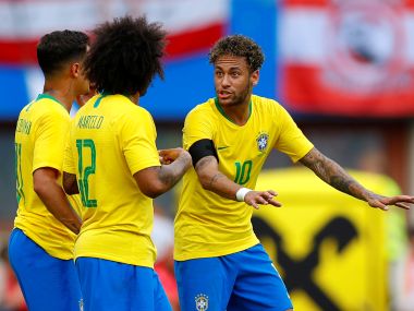Brazil's Neymar in conversation with Willian. Reuters