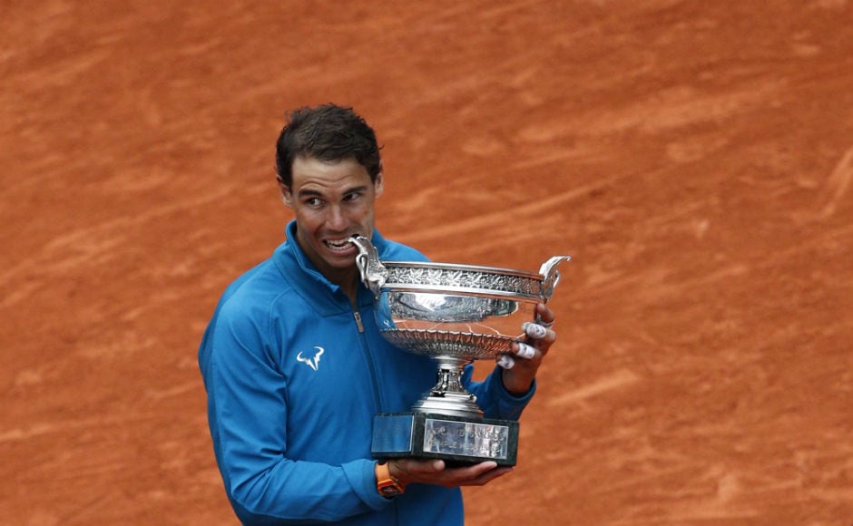 Spain's Rafael Nadal bites the cup after defeating Austria's Dominic Thiem in the men's final. AP Spain's Rafael Nadal bites the cup after defeating Austria's Dominic Thiem in the men's final. AP