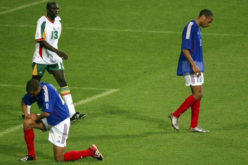 France's Thierry Henry and David Trezeguet at the final whistle after their loss to Senegal in the 2002 World Cup. Reuters