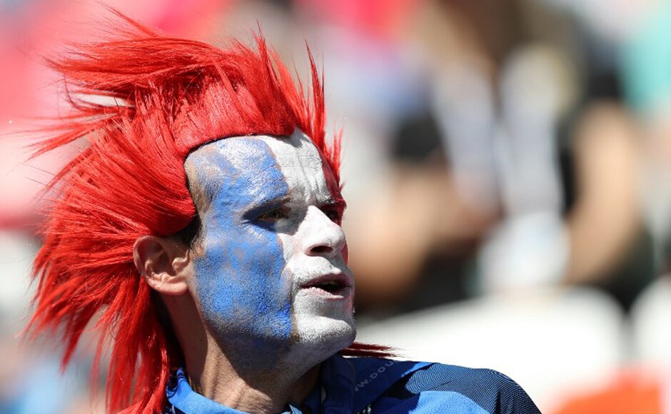 A French fan with the national flag painted on his face and wearing a wig looks on before the Russia 2018 World Cup Group C football match between France and Australia at the Kazan Arena in Kazan on 16 June, 2018. AFP A French fan with the national flag painted on his face and wearing a wig looks on before the Russia 2018 World Cup Group C football match between France and Australia at the Kazan Arena in Kazan on 16 June, 2018. AFP