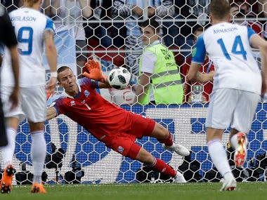 Iceland goalkeeper Hannes Halldorsson saves a penalty by Argentina's Lionel Messi during the group D match. AP