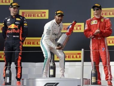 Lewis Hamilton celebrates on the podium after winning the French Grand Prix. AP