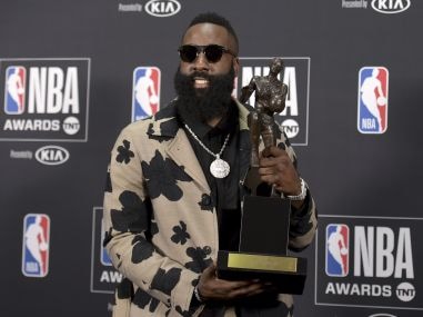 James Harden, of the Houston Rockets, poses with the Most Valuable Player award. AP