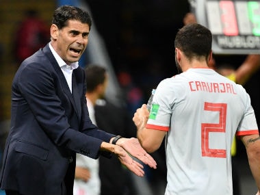 Spain's coach Fernando Hierro (L) speaks with Spain's defender Dani Carvajal. AFP