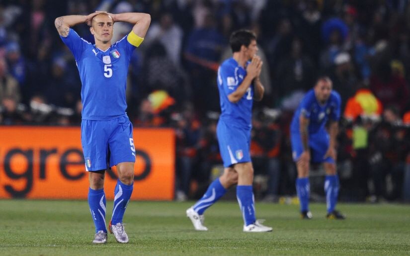 Italy's Fabio Cannavaro (L) looks dejected at the end of the Slovakia match after failing to qualify for the second round in the 2002 World Cup. Reuters