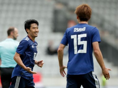 apan's Shinji Kagawa celebrates scoring their fourth goal with Yuya Osako. Reuters