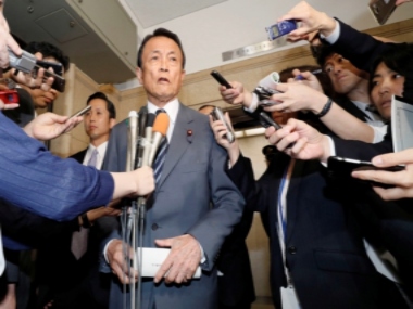 Japan finance minister Taro Aso returns a year's salary over land scandal; refuses to resign Japan finance minister Taro Aso returns a year's salary over land scandal; refuses to resign