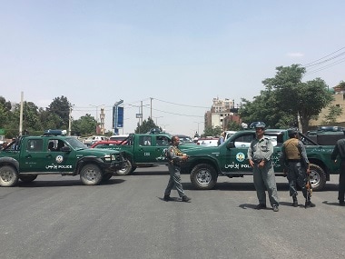 Security personnel block the road after the suicide attack in Kabul. AP
