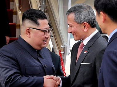 North Korean leader Kim Jong-un greeted by Singapore minister for foreign affairs. AP