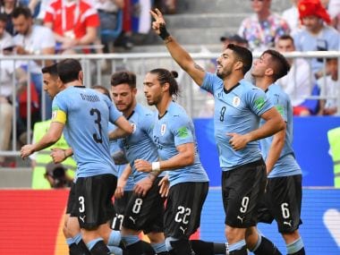 Uruguay's forward Luis Suarez (2ndR) celebrates with teammates after scoring against Russia. AFP