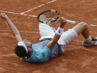 Italy's Marco Cecchinato celebrates winning his quarterfinal match of the French Open tennis tournament against Serbia's Novak Djokovic at the Roland Garros stadium in Paris. AP