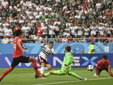 Mexico's forward Javier Hernandez (2L) scores their second goal against South Korea on Saturday. AFP