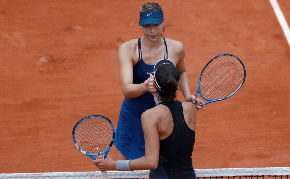Spain's Garbine Muguruza shakes hands with Russia's Maria Sharapova after winning their quarter-final match. Reuters Spain's Garbine Muguruza shakes hands with Russia's Maria Sharapova after winning their quarter-final match. Reuters
