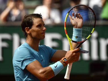 Rafael Nadal celebrates after victory against Richard Gasquet in their men's singles third round match of French Open. AFP