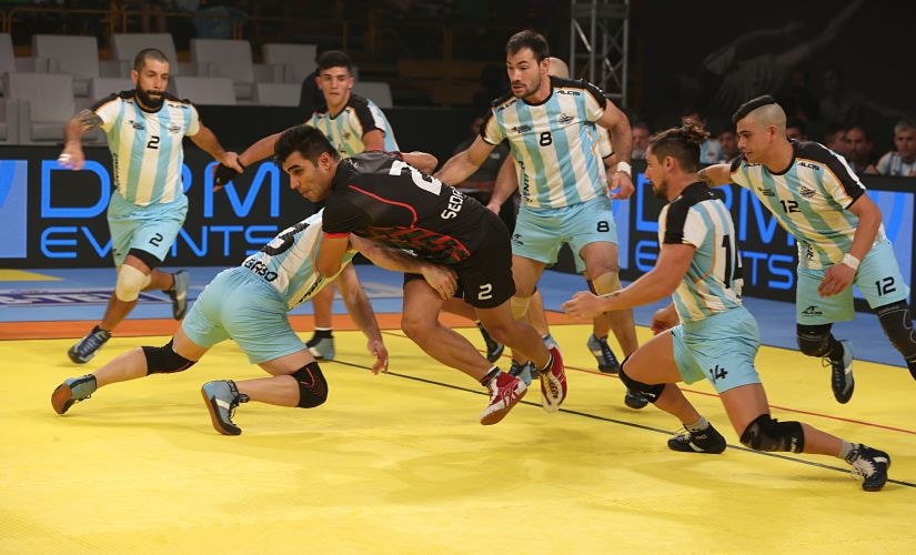 Argentina players tackle an Iranian raider during their clash at the Kabaddi Masters Dubai. Image Courtesy: Star Sports