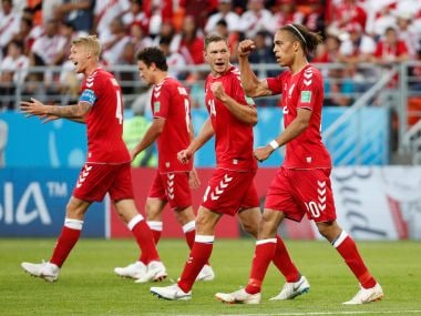 Denmark's Yussuf Poulsen celebrates scoring their first goal with teammates. Reuters