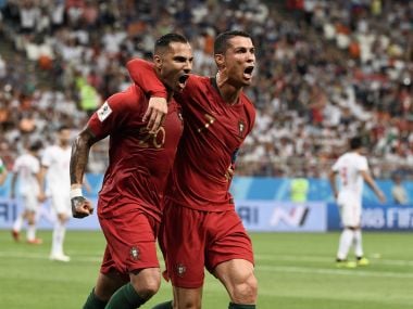 Portugal's Ricardo Quaresma (left) celebrates scoring the opening goal with Cristiano Ronaldo against Iran. AFP