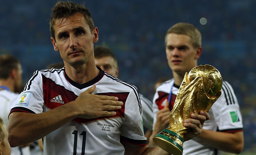 Germany's Miroslav Klose holds the World Cup trophy after the 2014 World Cup final against Argentina at the Maracana stadium in Rio de Janeiro July 13, 2014. REUTERS/Eddie Keogh (BRAZIL - Tags: SOCCER SPORT WORLD CUP) - TB3EA7D1U8Y8P