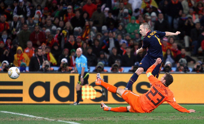 Football - Holland v Spain FIFA World Cup Final - South Africa 2010 - Soccer City Stadium, Johannesburg, South Africa - 11/7/10 Andres Iniesta scores the first goal for Spain under pressure from Holland's Rafael Van Der Vaart Mandatory Credit: Action Images / Andrew Boyers Livepic - MT1ACI7161254