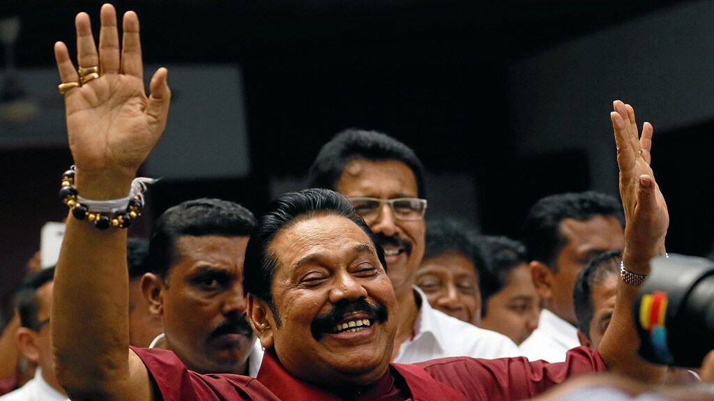 Rajapaksa waves at his supporters after winning the local government election in Colombo. — REUTERS
