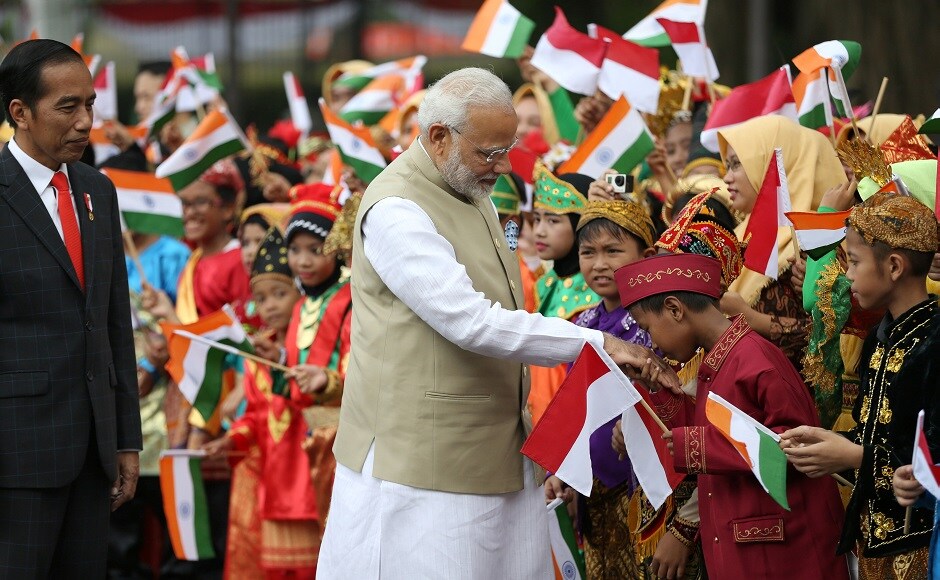 School students and Indonesian President Joko Widodo welcomed PM Modi on Wednesday at Merdeka Palace in Jakarta, Indonesia on Wednesday. This was Modi's first-ever official visit to Indonesia. Reuters School students and Indonesian President Joko Widodo welcomed PM Modi on Wednesday at Merdeka Palace in Jakarta, Indonesia on Wednesday. This was Modi's first-ever official visit to Indonesia. Reuters