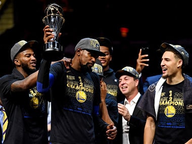 Jun 8, 2018; Cleveland, OH, USA; Golden State Warriors forward Kevin Durant (35) celebrates with the Bill Russell NBA Finals Most Valuable Player Award after beating the Cleveland Cavaliers in game four of the 2018 NBA Finals at Quicken Loans Arena. Mandatory Credit: Kyle Terada-USA TODAY Sports - 10881597