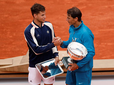 Tennis - French Open - Roland Garros, Paris, France - June 10, 2018 Spain's Rafael Nadal shakes hands with Austria's Dominic Thiem after winning their final REUTERS/Gonzalo Fuentes - RC118D849100