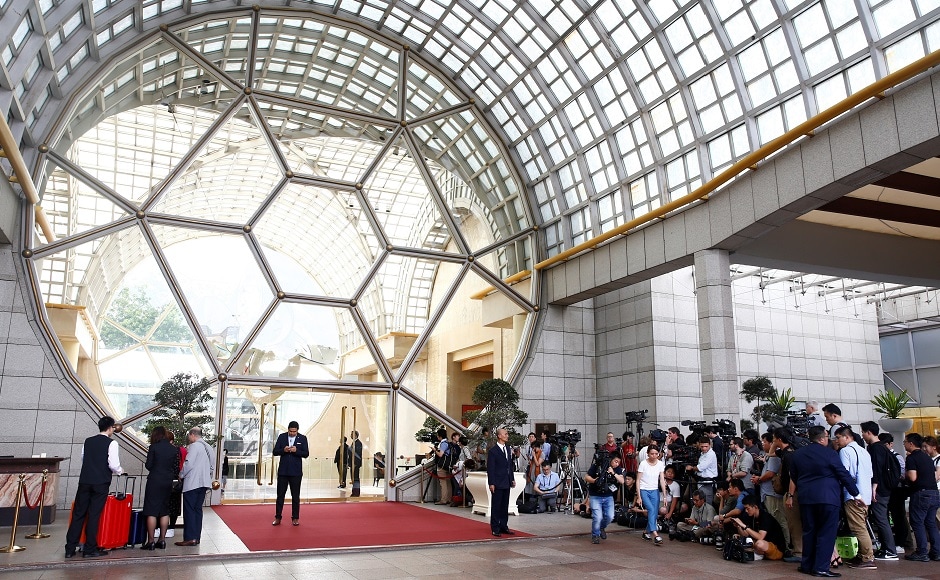 Media gathers outside the Ritz-Carlton hotel in Singapore, on Monday. The meeting to be held here is believed to be led by US ambassador to the Philippines Sung Kim and North Korean Vice-Foreign Minister Choe Son Hui. The talks are aimed at making eleventh-hour progress ahead of the Trump-Kim summit. Reuters Media gathers outside the Ritz-Carlton hotel in Singapore, on Monday. The meeting to be held here is believed to be led by US ambassador to the Philippines Sung Kim and North Korean Vice-Foreign Minister Choe Son Hui. The talks are aimed at making eleventh-hour progress ahead of the Trump-Kim summit. Reuters