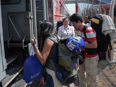 Football fans for the 2018 World Cup boarding a train in Saransk. AFP